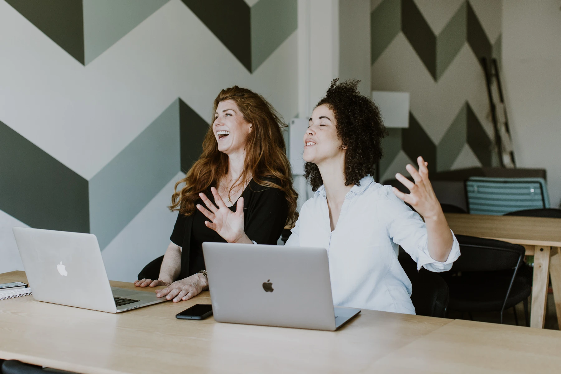 beta-and-beyond-team-desk-laughing-LA-h